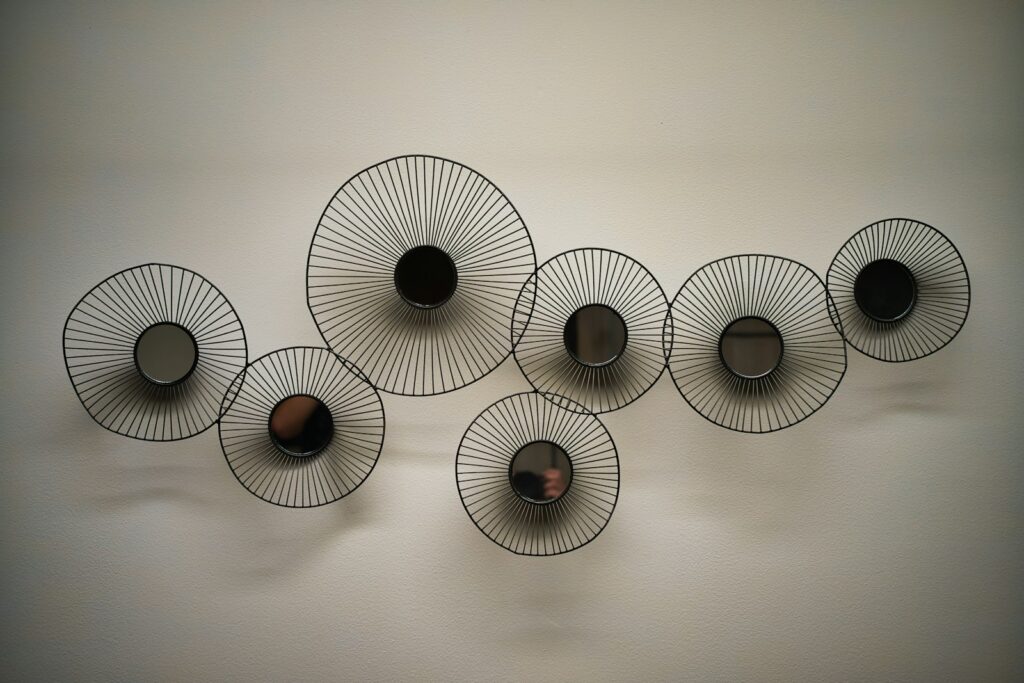 A group of black and white objects hanging on a wall